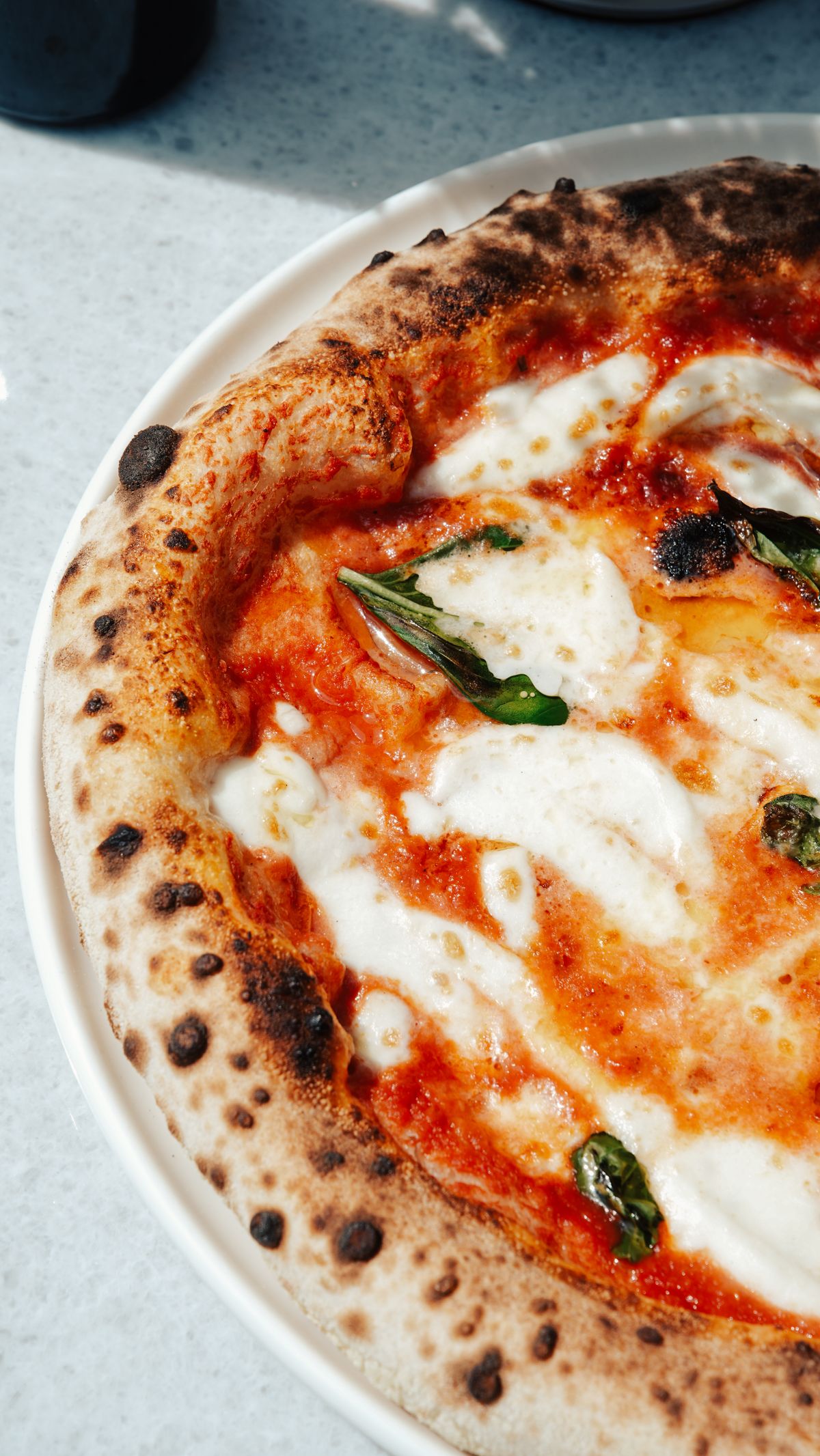 Illustrative pizza photograph; this is not The Social – Sports Bar & Grill